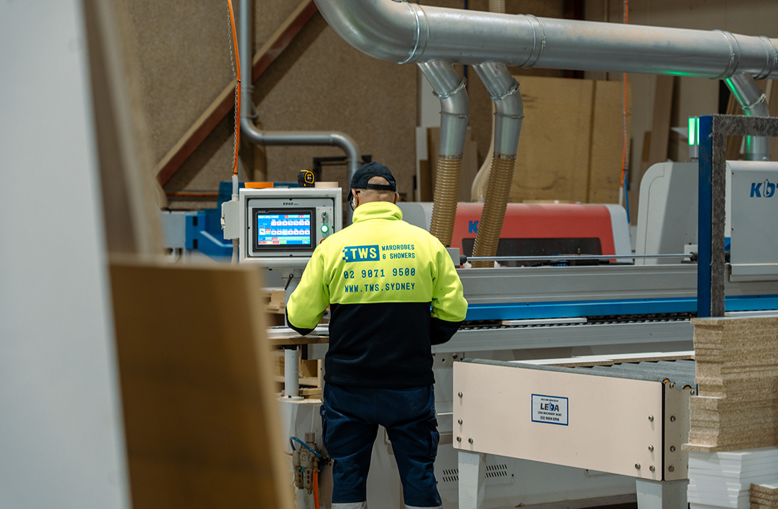 In-house CNC machine cutting a panel.